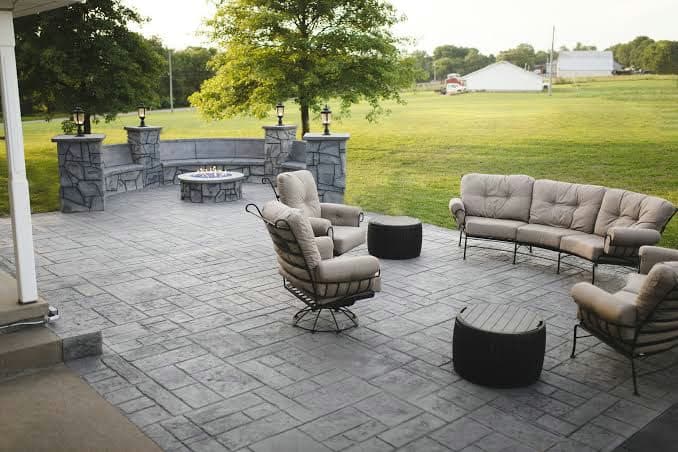 Colored concrete patio with outdoor seating