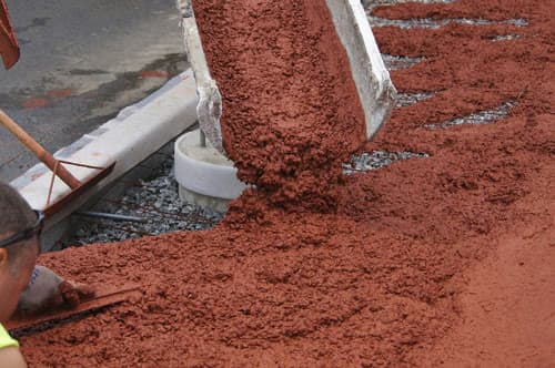 Integrally colored concrete discharged from a mixer chute