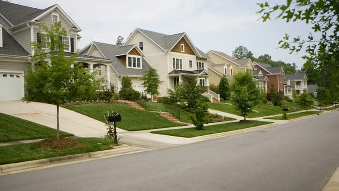 Curb-lined street through a planned residential community