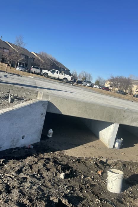 Precast concrete box culvert installed near a residential street