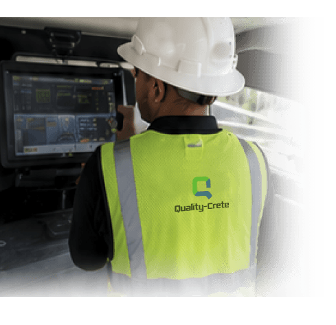 Quality-Crete operator monitoring production at the mixer control panel