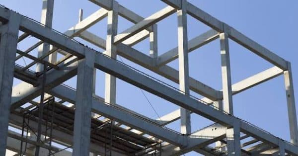 Structural steel frame against a blue sky