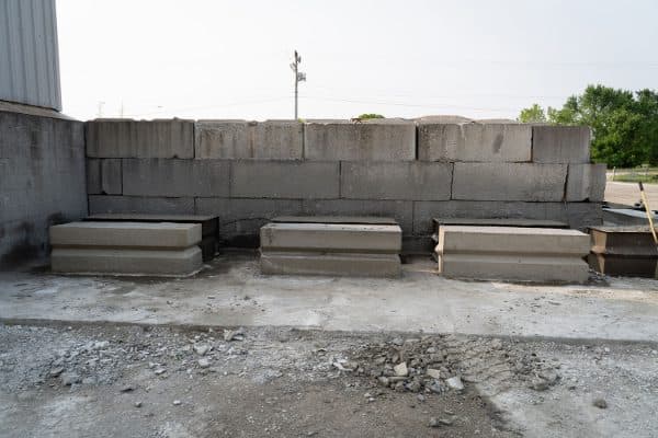 Stacked concrete barrier blocks on a site