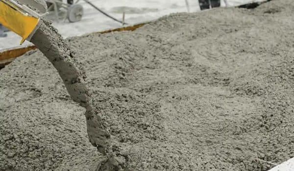 Fresh concrete placed from a chute for a roadway slab