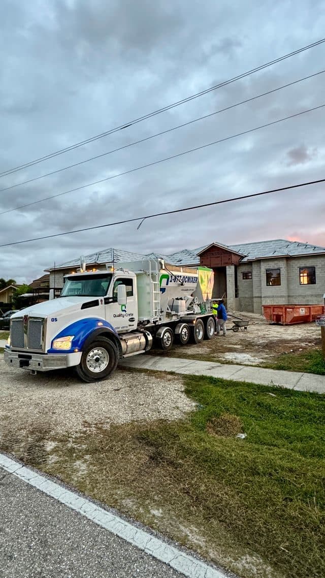 Quality-Crete mixer parked outside a newly built home