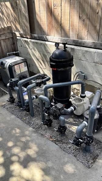 Pool pumps and filters on an equipment pad